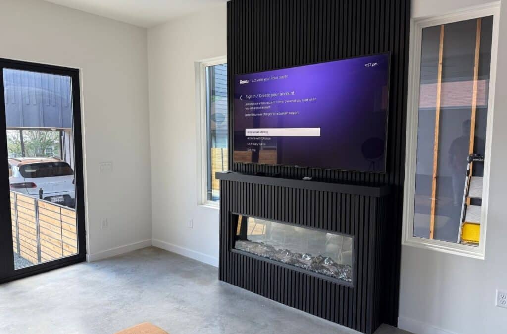 A Mount It ATX technician performing precise mounting work in Central Austin, TX using professional tools for secure, high-quality installation.